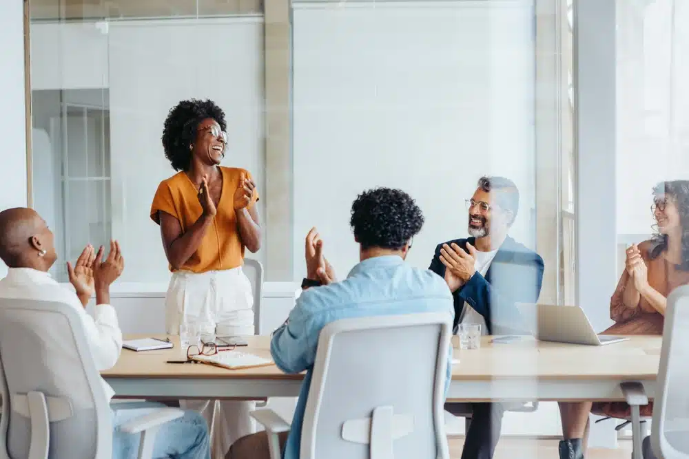 Team meeting around plans in an office
